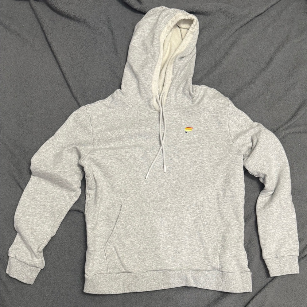 Fabletics Pride Collection hoodie in gray heather mist with a rainbow chest logo